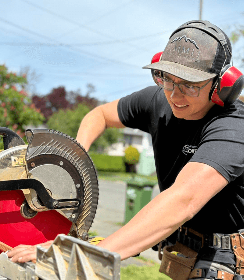 Matt Turnbull (owner of Climate Custom Decks) using a chop saw